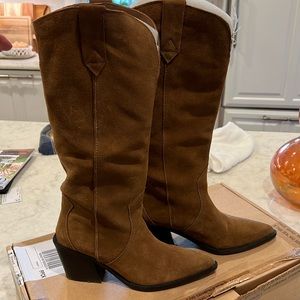 Tall suede cowboy boots comes to knee. Awesome style!! Goes with everything!!